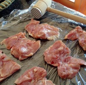 Chicken thighs on cling film