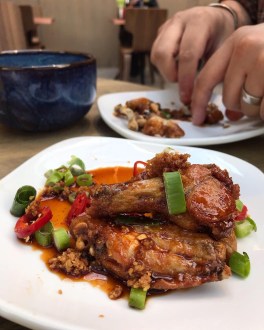 Eating chicken wings Chi The Grafton Cambridge